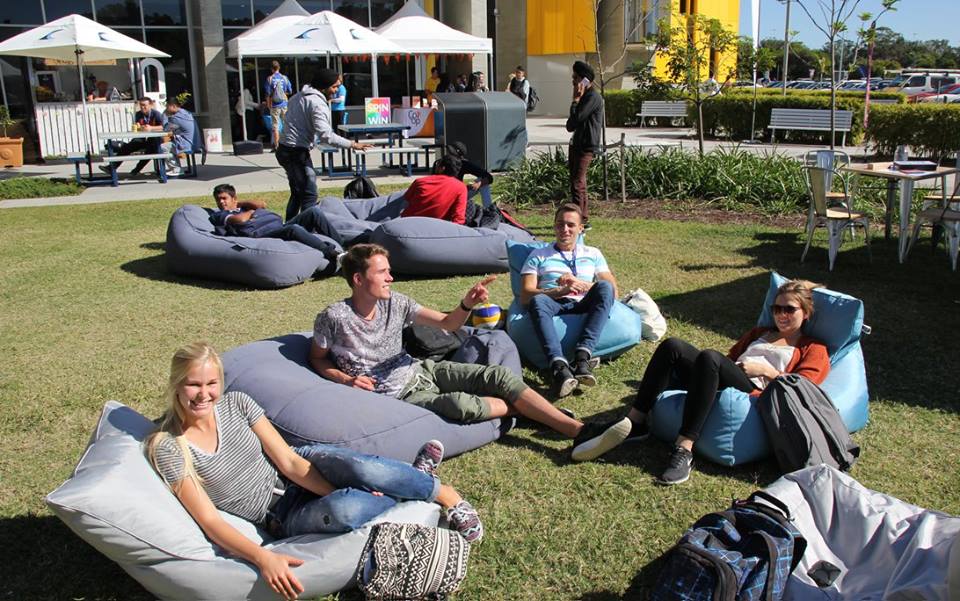 Students lying back on beanbags at the Gold Coast Orientation